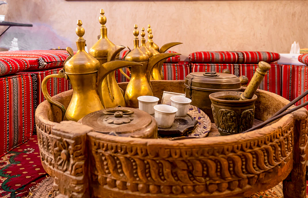 Traditional Arabic coffee pots and cultural artifacts inside Dubai Coffee Museum.