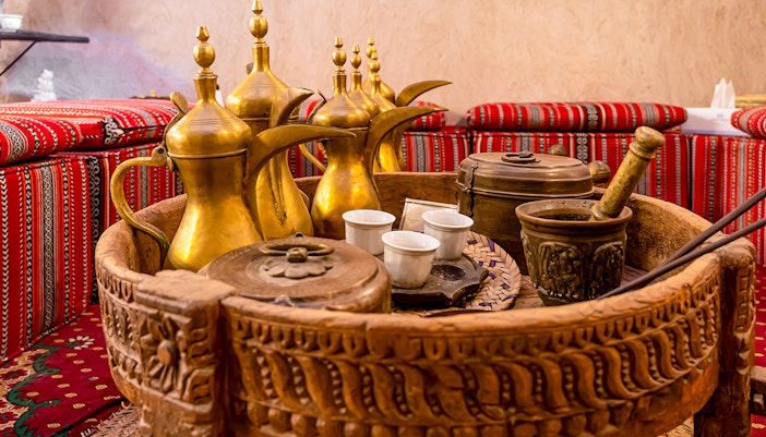 Traditional Arabic coffee pots and cultural artifacts inside Dubai Coffee Museum.