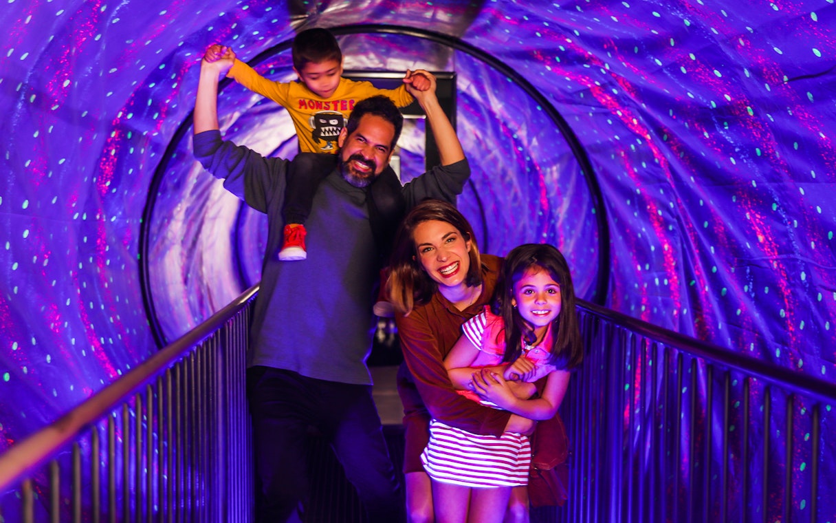 Family enjoying Vortex Tunnel at Museum of Illusions Madrid.