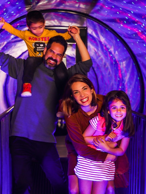 Family enjoying Vortex Tunnel at Museum of Illusions Madrid.