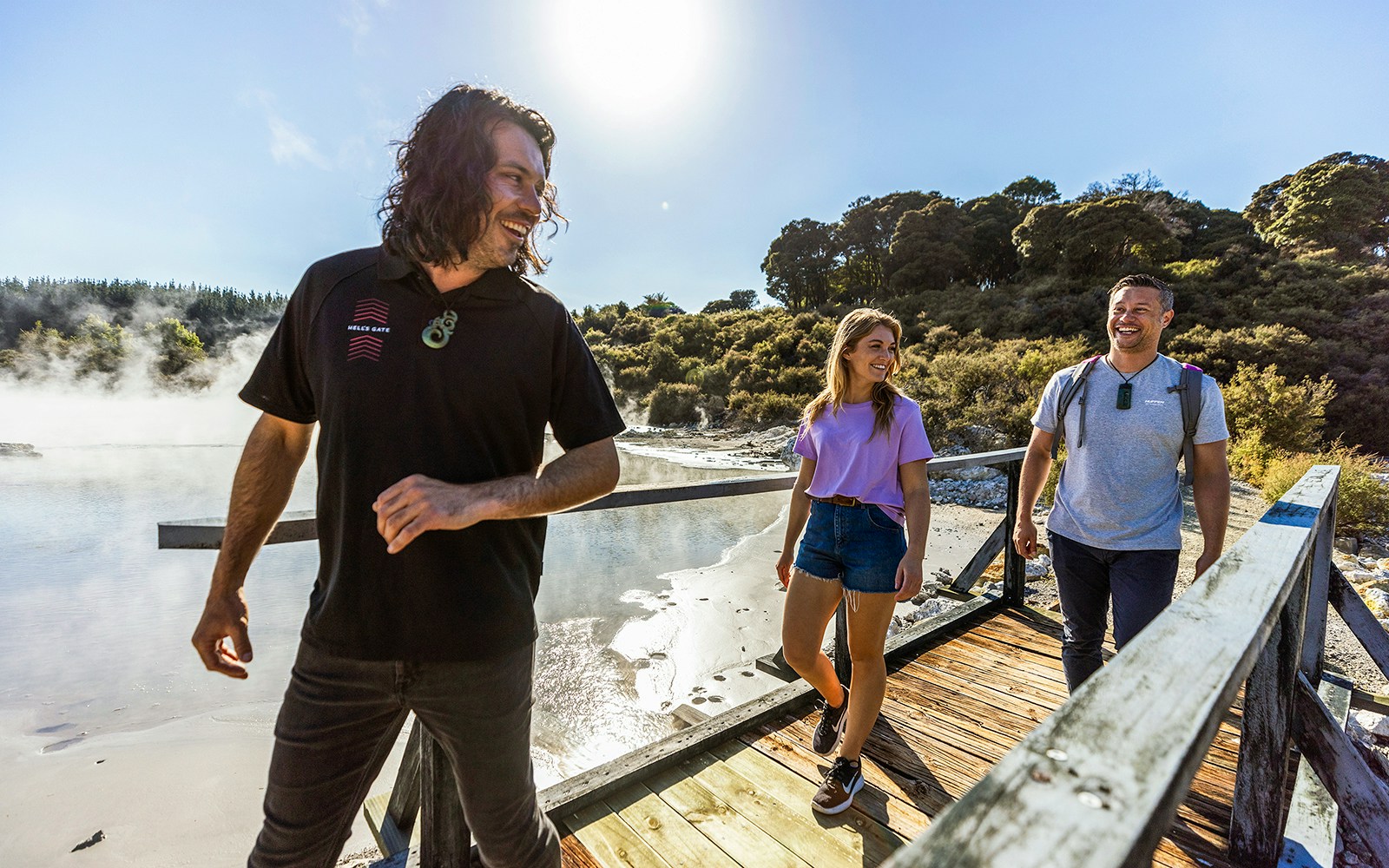 Tourists enjoying a guided walk at Hells Gate Geothermal Park, New Zealand.
