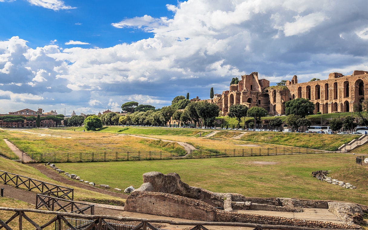 Circus Maximus ruins with surrounding greenery in Rome, Italy.