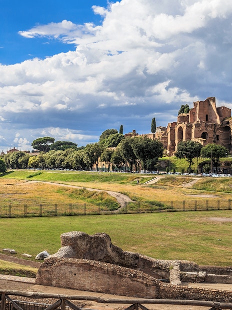 Circus Maximus ruins with surrounding greenery in Rome, Italy.