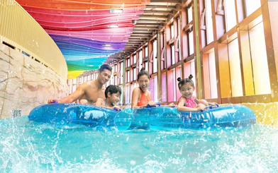 Family enjoying a water ride at Water World Ocean Park Hong Kong.