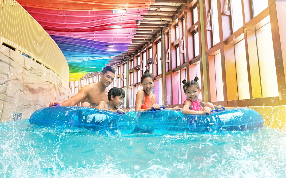Family enjoying a water ride at Water World Ocean Park Hong Kong.