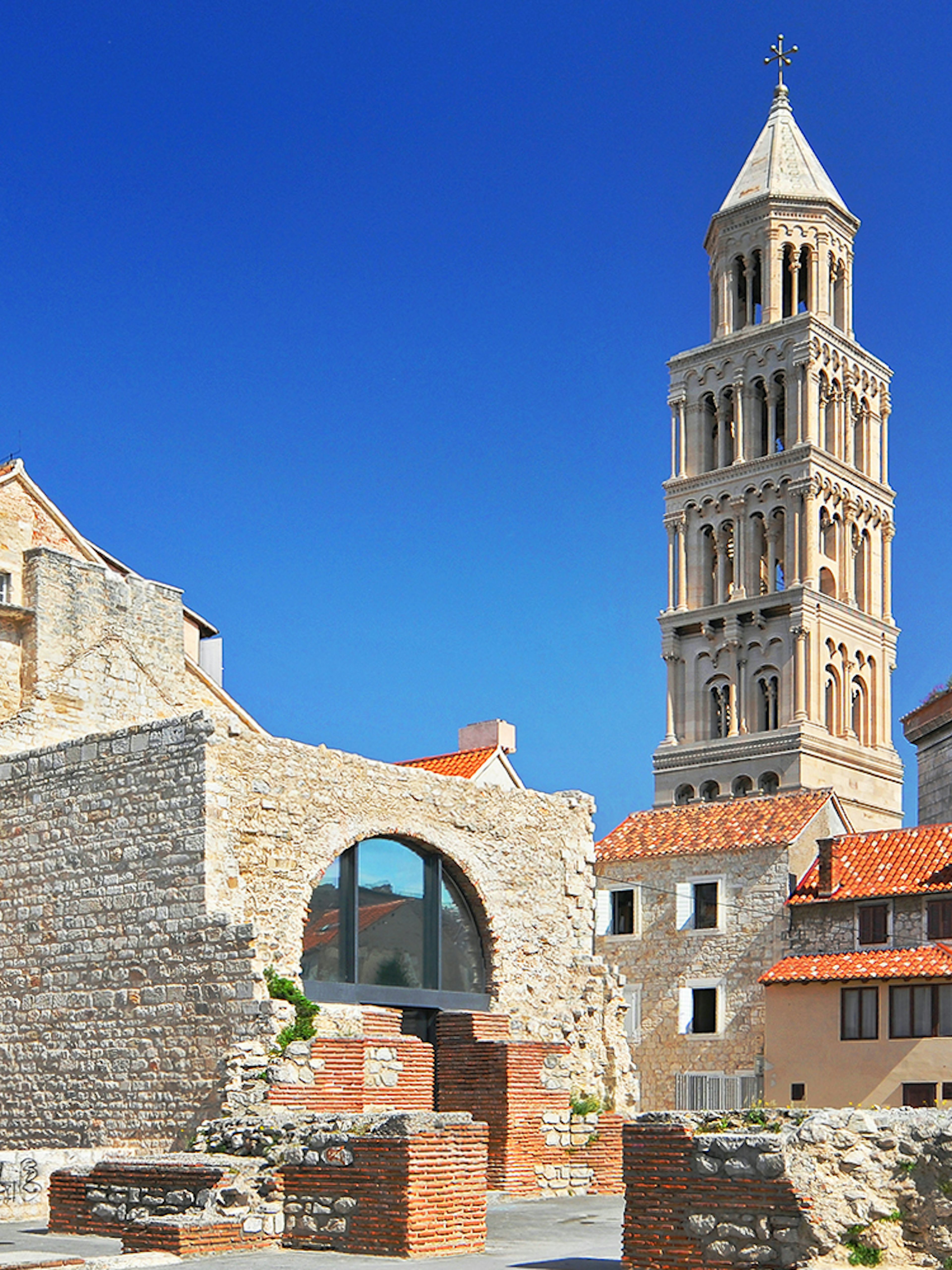 Diocletian's Palace with bell tower in Split, Croatia, showcasing historic architecture.
