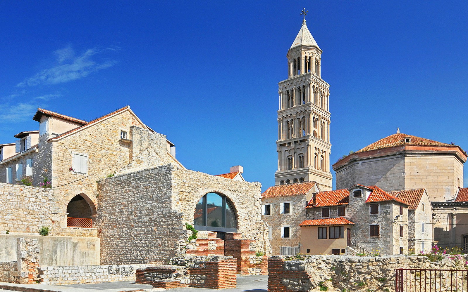 Diocletian's Palace with bell tower in Split, Croatia, showcasing historic architecture.