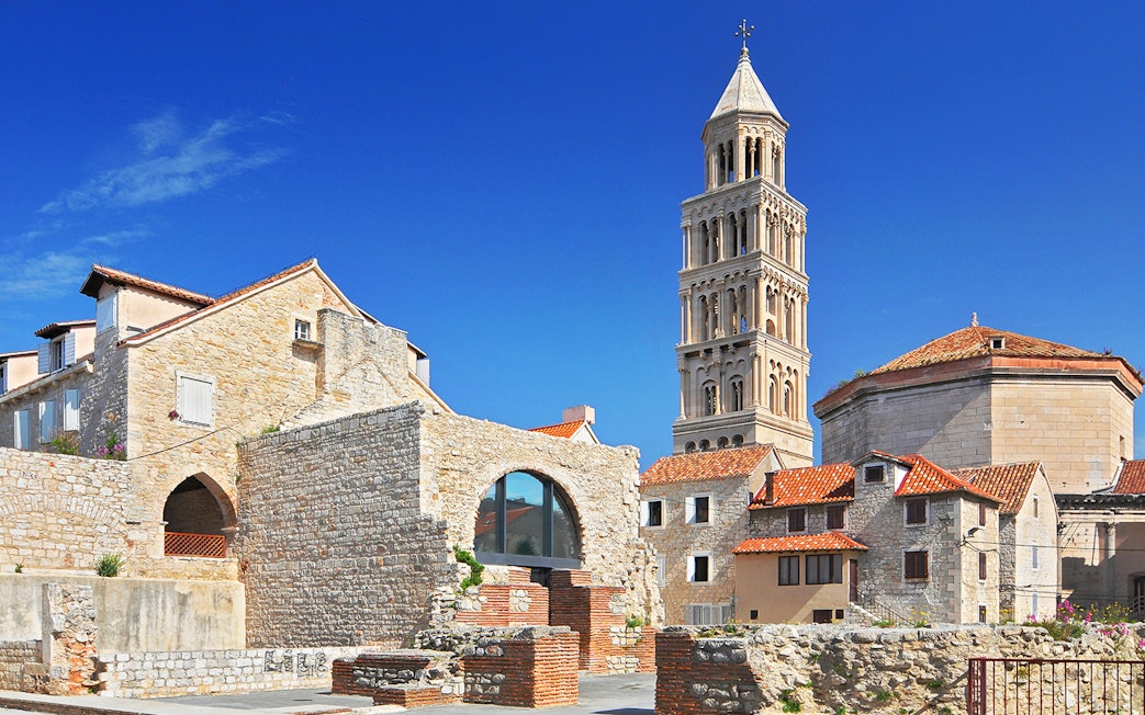 Diocletian's Palace with bell tower in Split, Croatia, showcasing historic architecture.