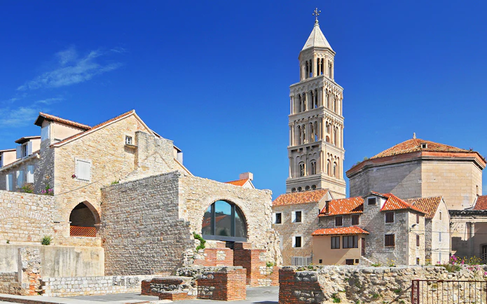 Diocletian's Palace with bell tower in Split, Croatia, showcasing historic architecture.
