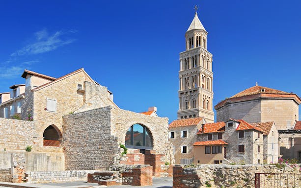 Diocletian's Palace with bell tower in Split, Croatia, showcasing historic architecture.