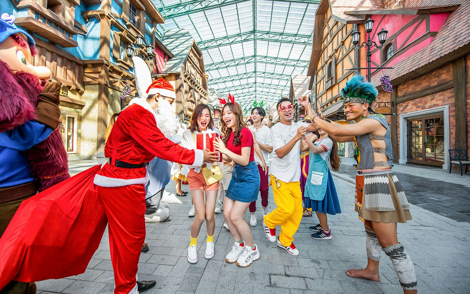 Visitors enjoying festive entertainment at VinWonders theme park.