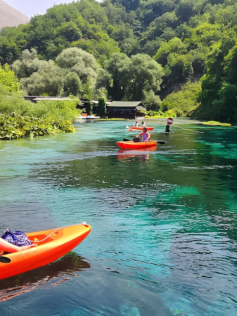 Kayakers exploring the Blue Eye spring in Albania.