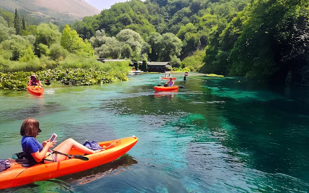 Kayakers exploring the Blue Eye spring in Albania.
