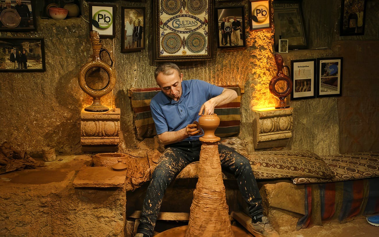 Potter crafting clay vase during Cappadocia Authentic Pottery Workshop Experience.
