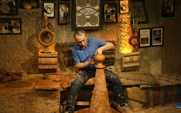 Potter crafting clay vase during Cappadocia Authentic Pottery Workshop Experience.