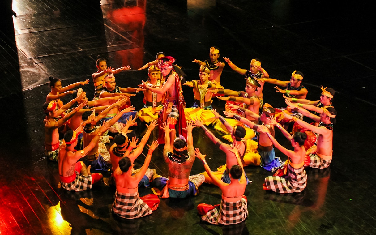 Performers in traditional attire at the Devdan Show, Bali, showcasing Indonesian dance.