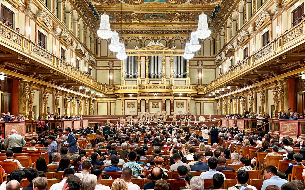 Audience seated in the ornate Musikverein concert hall, Vienna, for Vivaldi and Mozart performance.