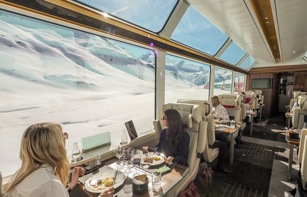 Passengers relishing meal on swiss train