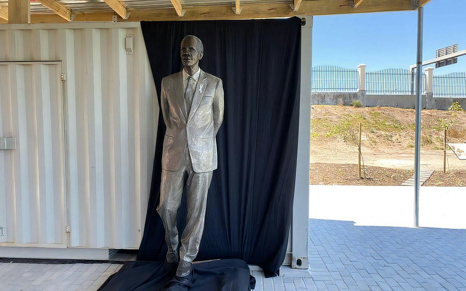 Statue of a man in a suit at Long March to Freedom Exhibition.