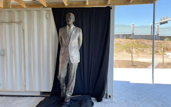 Statue of a man in a suit at Long March to Freedom Exhibition.