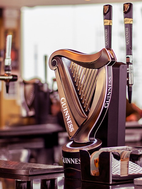 Guinness Storehouse beer taps with harp design in Dublin.