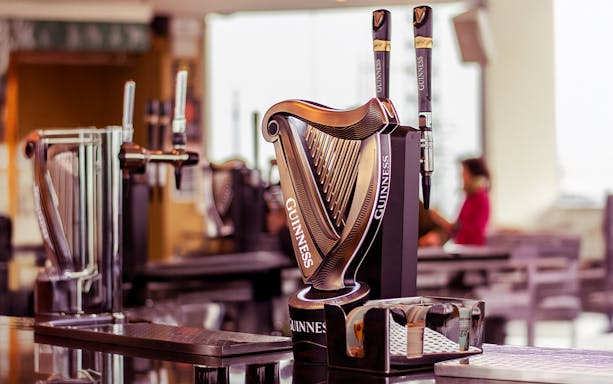 Guinness Storehouse beer taps with harp design in Dublin.