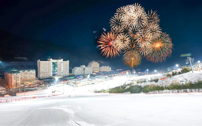 Fireworks display over Vivaldi Park Ski World at night.