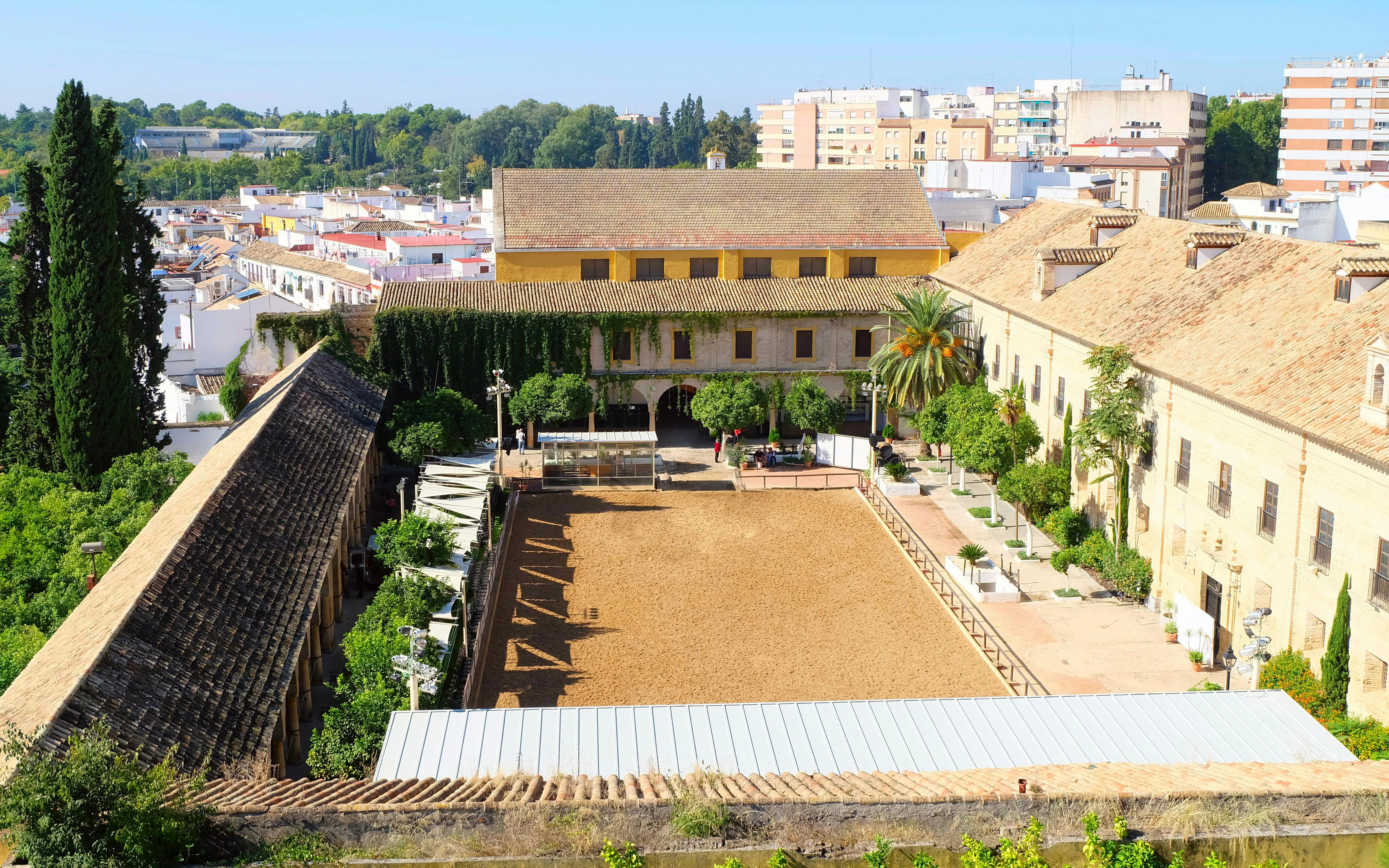 Royal Stables of Cordoba courtyard with historic architecture and training arena, Cordoba, Spain.