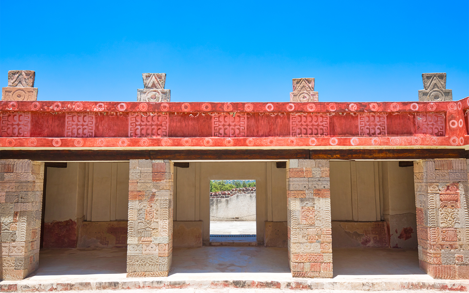 Murals at Palacio de Atetelco depicting ancient Aztec warriors and deities in vibrant colors.