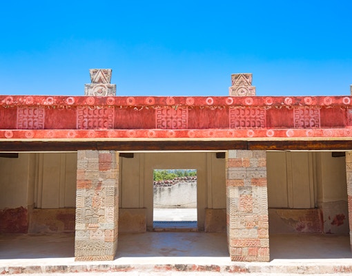 Murals at Palacio de Atetelco depicting ancient Aztec warriors and deities in vibrant colors.