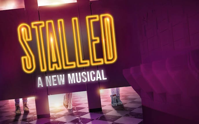 Stalled musical poster with restroom stalls and shoes visible underneath.