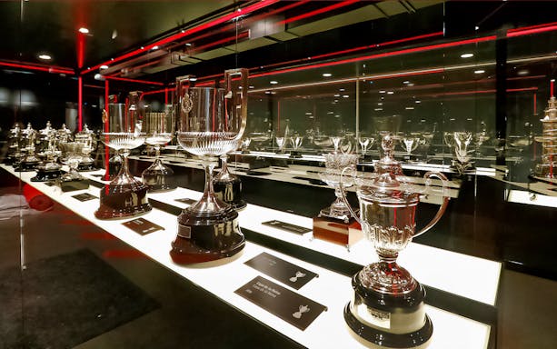 Trophies displayed in Atletico de Madrid Stadium Museum exhibit.