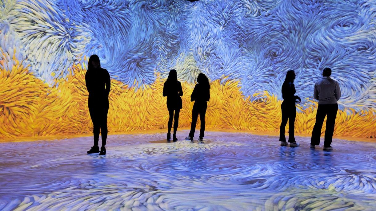 Visitors at Van Gogh Remastered audiovisual experience in Rotterdam.