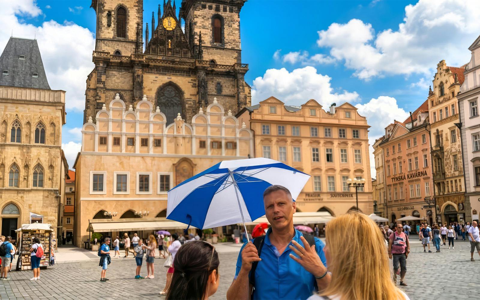 Tour guide explaining Prague Astronomical Clock in Old Town Square, Prague.
