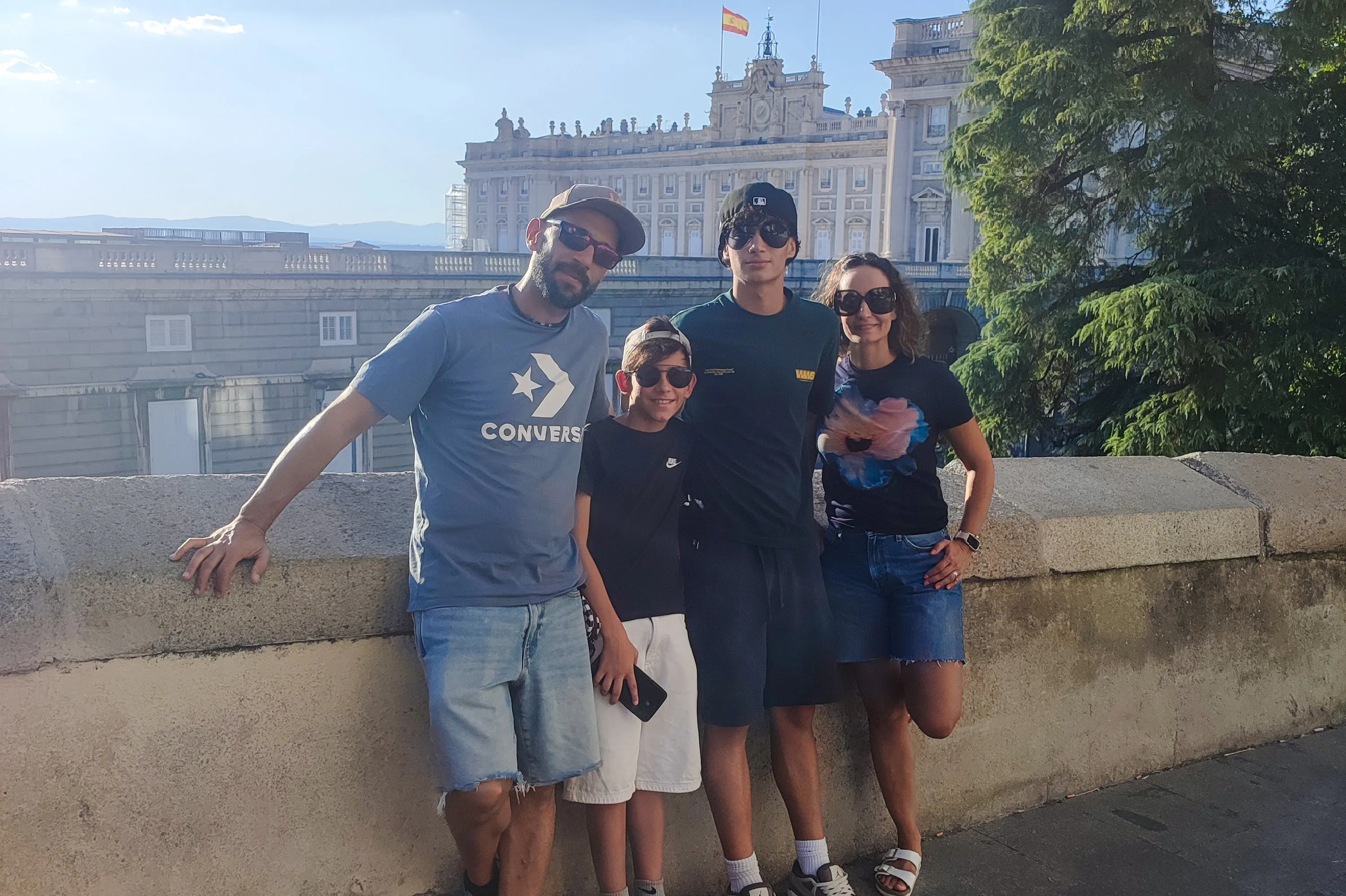Group posing in front of the Royal Palace during a private tour in Madrid.