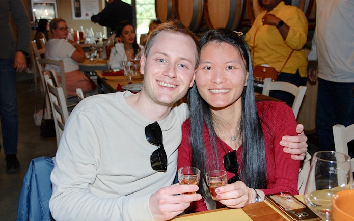 Couple enjoying wine tasting in a Tuscan winery during Best of Tuscany tour from Rome.