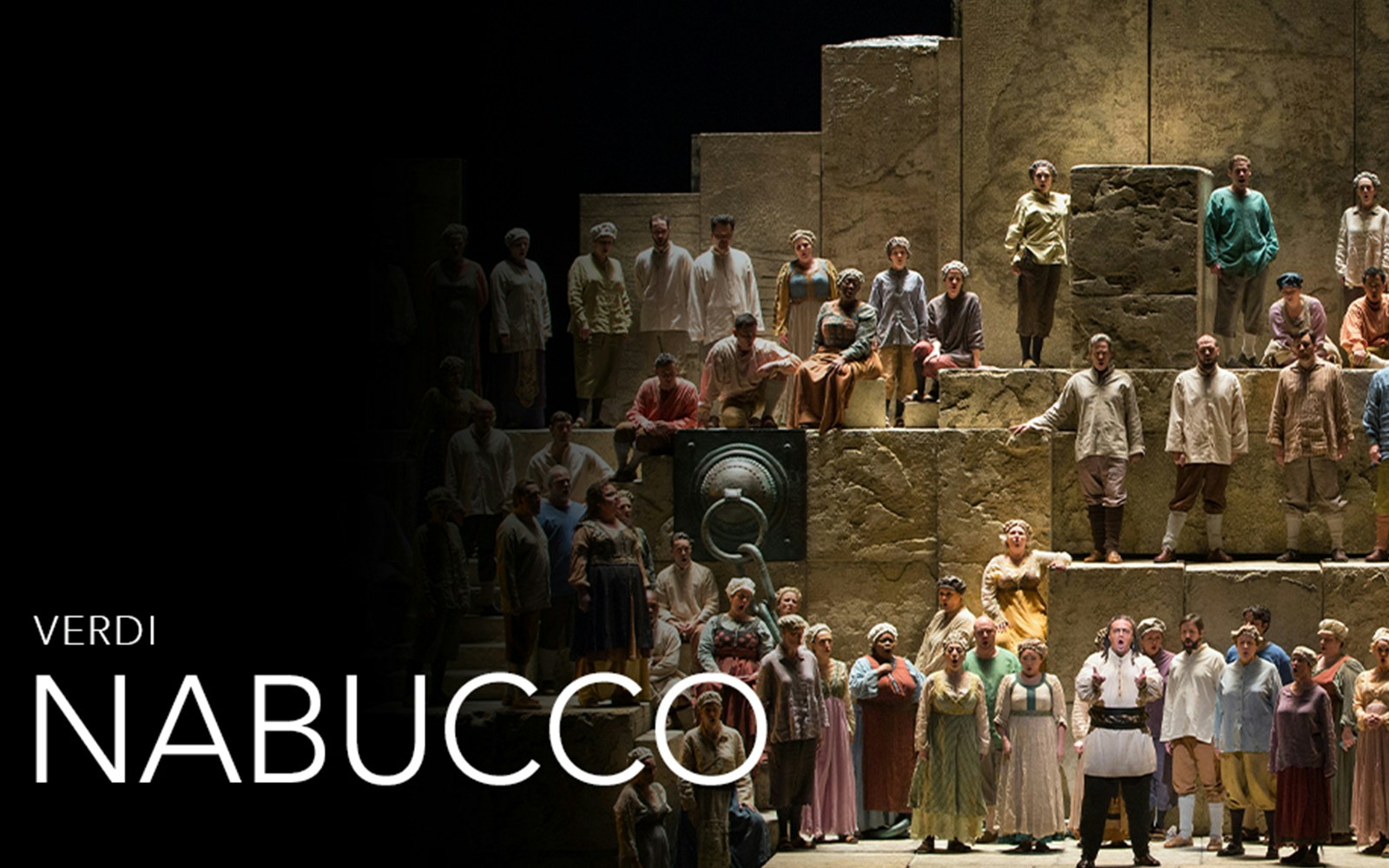 Chorus performing in Verdi's opera Nabucco on a grand stage.