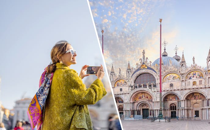 Tourist photographing St. Mark's Basilica in Venice, Italy.