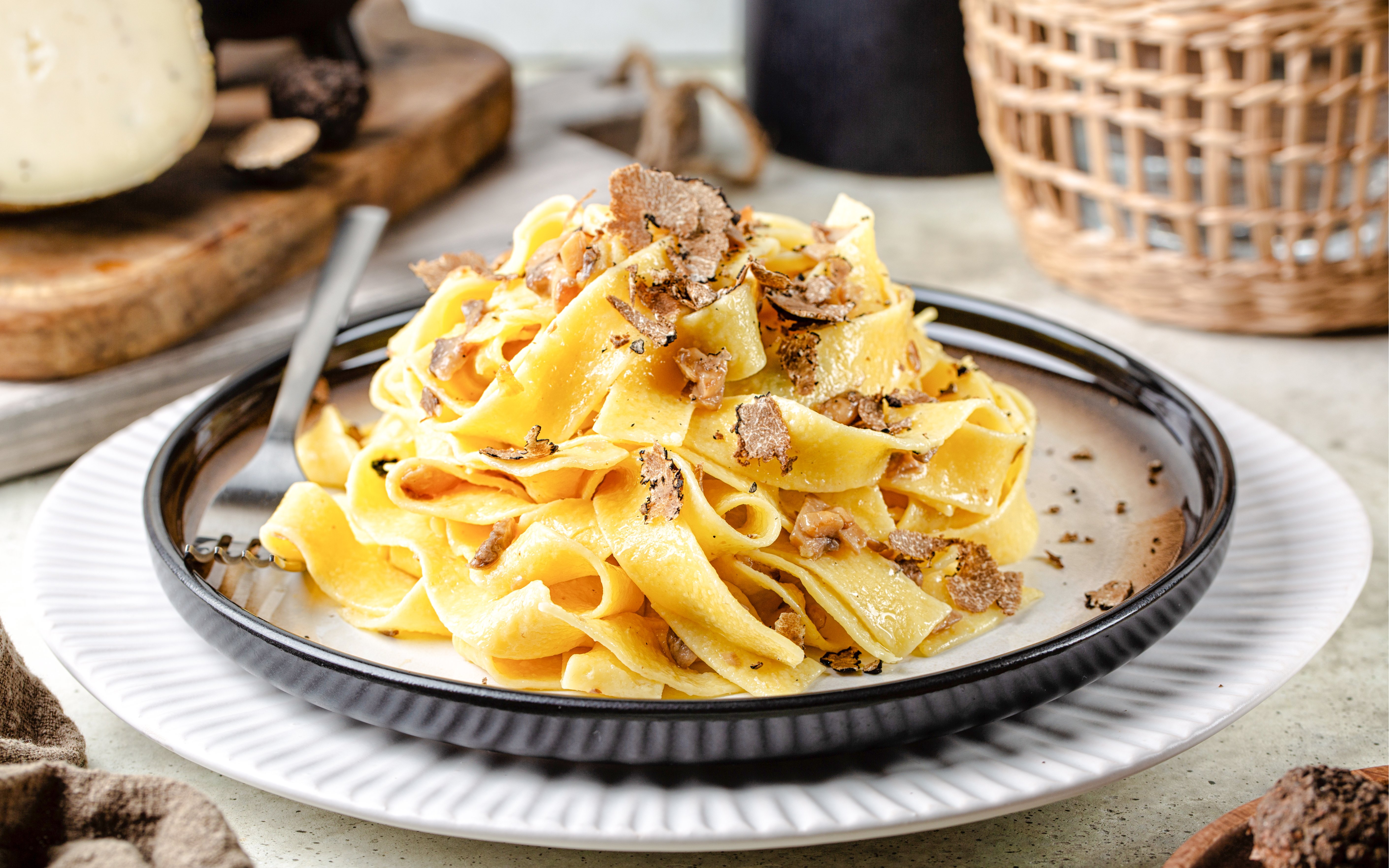 Truffle pasta dish at Delphi Restaurant with shaved truffles on a plate.