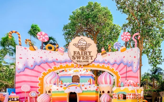 Fairy Sweet Village entrance with candy-themed decorations and colorful structures.