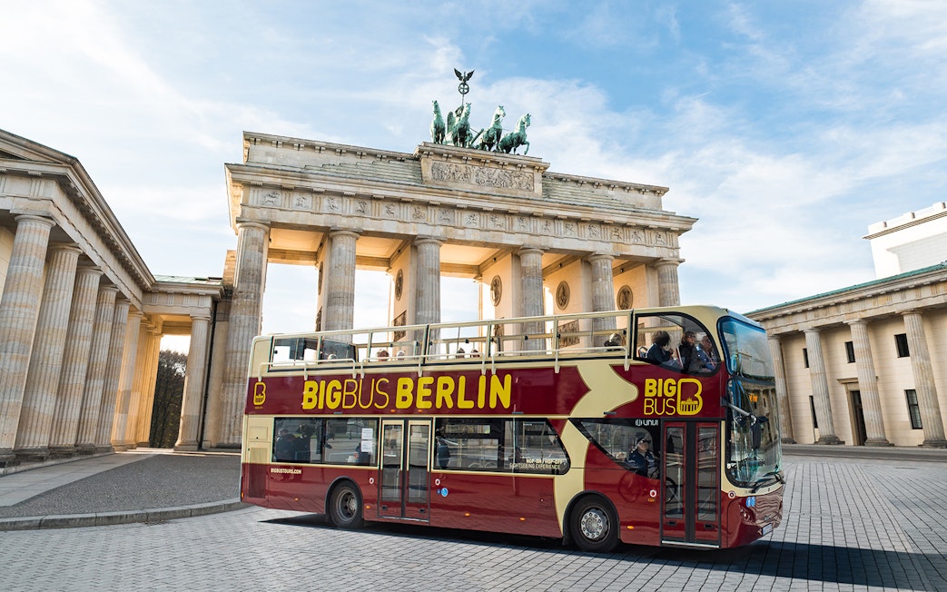 Big Bus Berlin tour bus in front of the Brandenburg Gate.