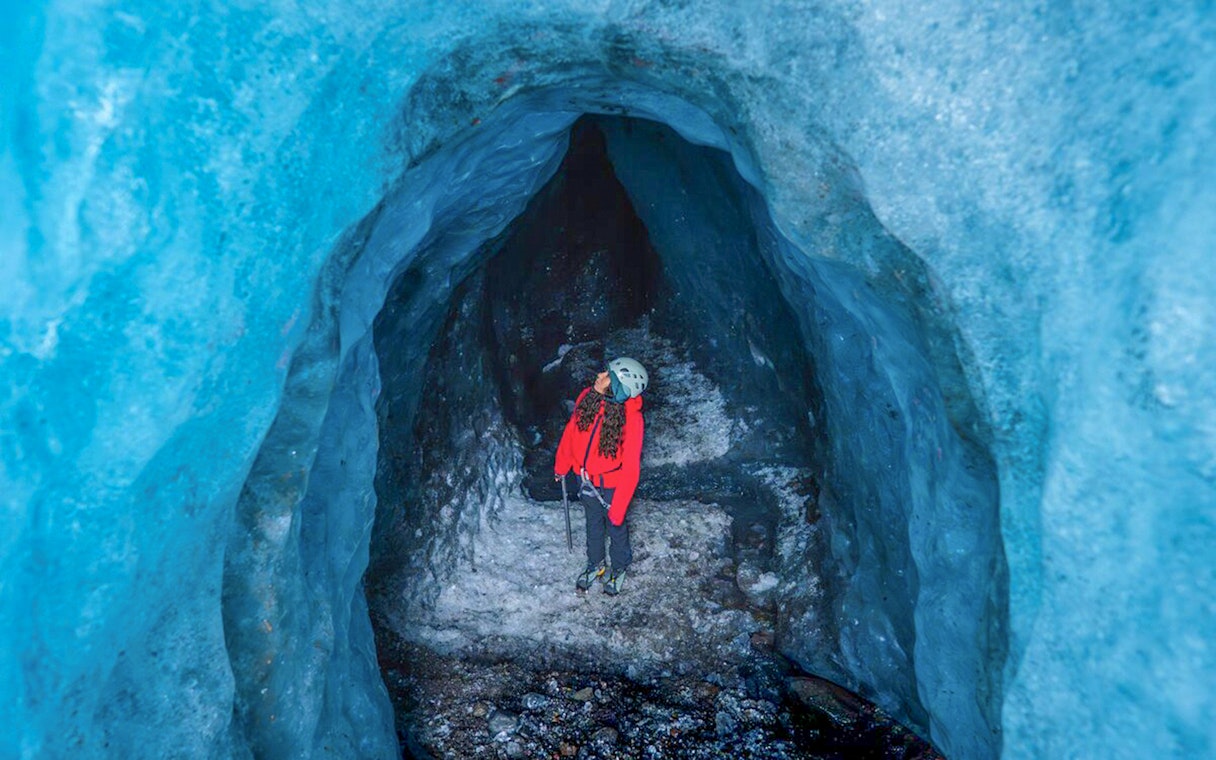Guests exploring inside Blue Ice Cave in Vatnajökull, Iceland.