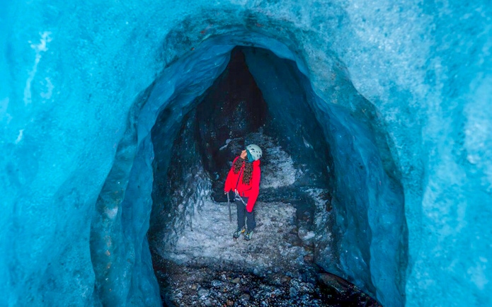 Guests exploring inside Blue Ice Cave in Vatnajökull, Iceland.
