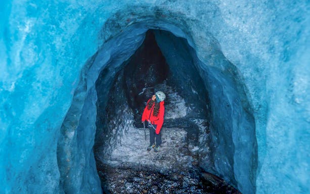 Guests exploring inside Blue Ice Cave in Vatnajökull, Iceland.