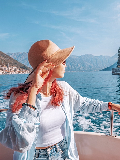 Guests on boat near Our Lady of the Rocks, Montenegro, during private tour.