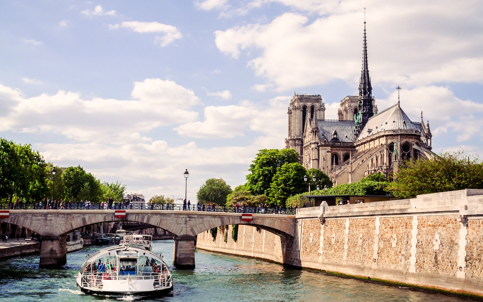 Seine River cruise near Notre-Dame Cathedral in Paris, France.