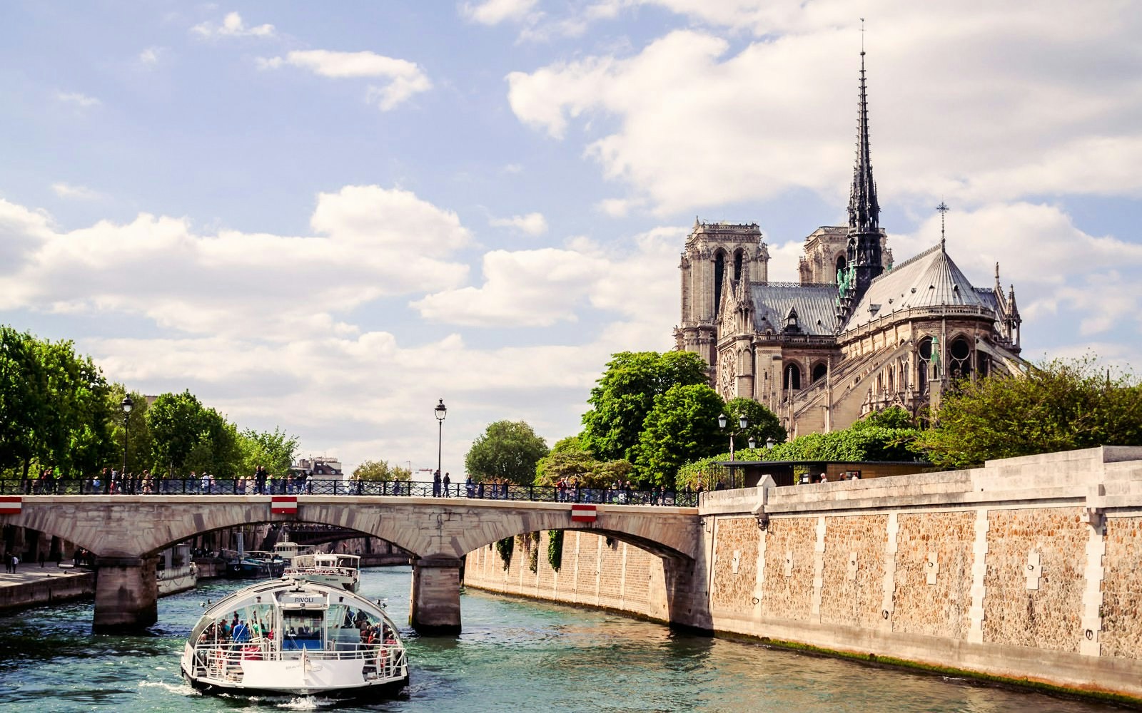 Seine River cruise near Notre-Dame Cathedral in Paris, France.