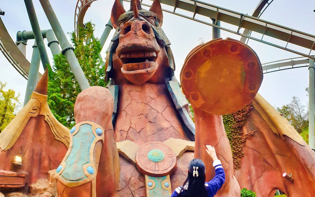 Giant horse statue with visitor at Gyeongju World theme park.