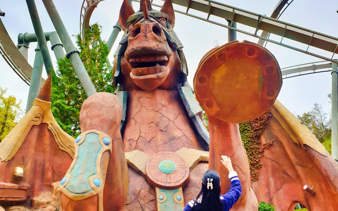 Giant horse statue with visitor at Gyeongju World theme park.