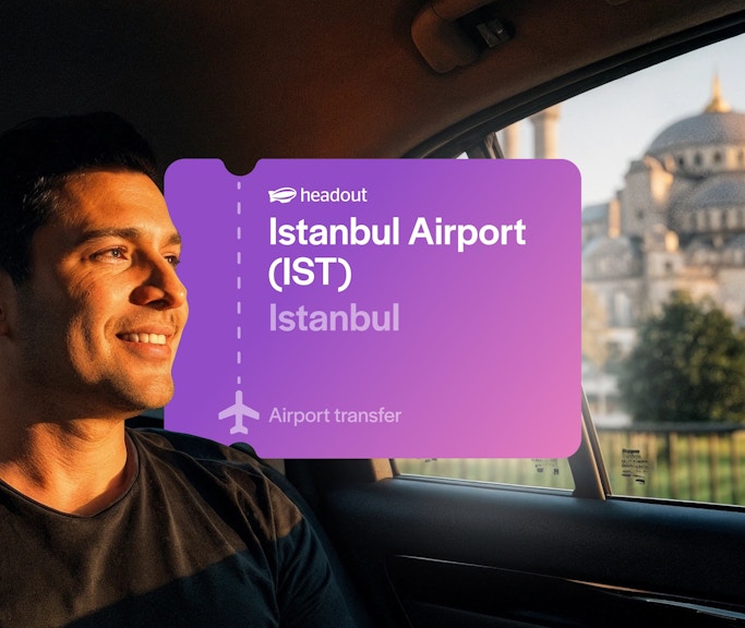Man in car with Blue Mosque view, Istanbul airport transfer.